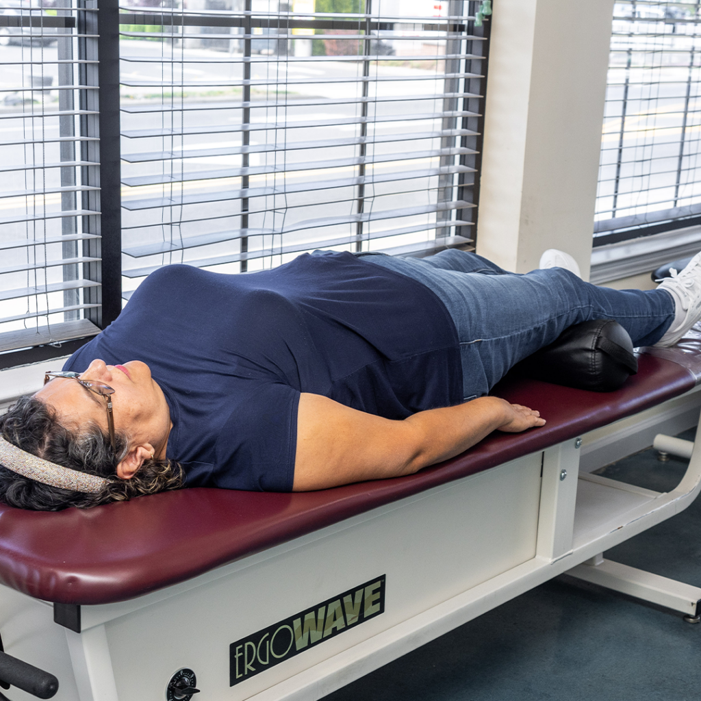 woman laying down for a sciatica care